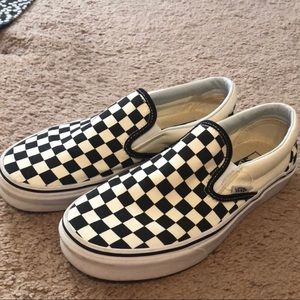 Checkered Vans slip-ons